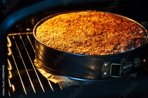 Cake in the oven, baking apple pie