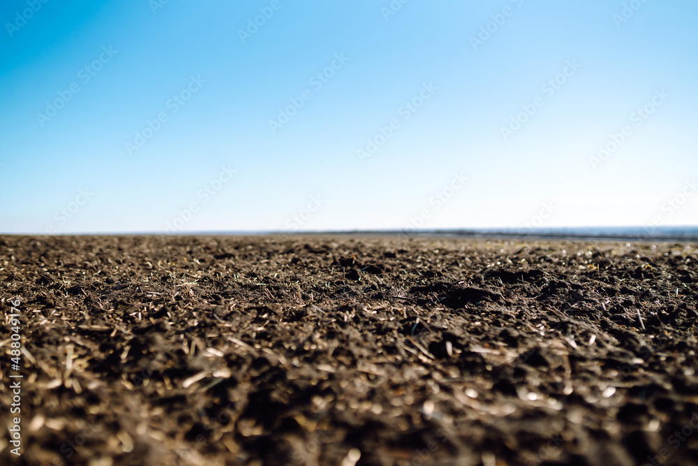 Empty and plowed fields, preparation for next harvest. Agriculture, soil before sowing. Gardening or ecology concept. Empty and plowed fields, preparation for next harvest. Agriculture, soil before sowing. Gardening or ecology concept.