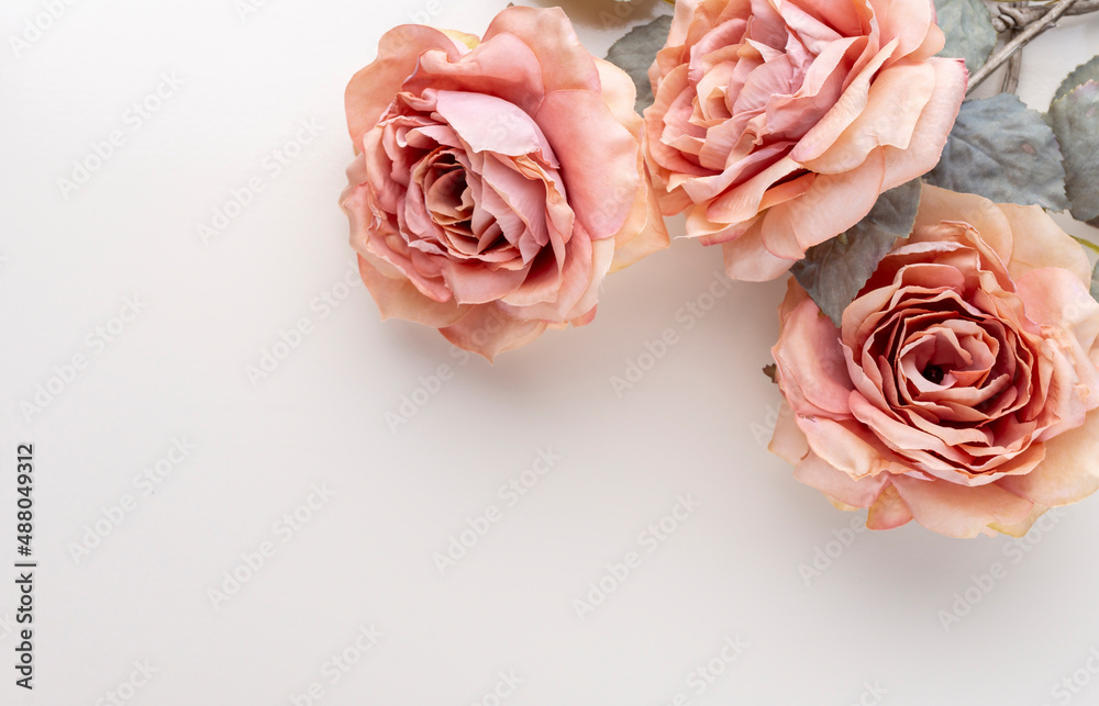 Flowers composition. Bouquet of pink roses in pastel colors. Flatlay.