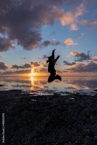 silhouette of jumping woman in Iceland