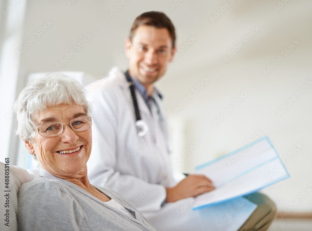 Youre in great hands. Shot of a handsome male doctor with a happy elderly patient. Youre in great hands. Shot of a handsome male doctor with a happy elderly patient.