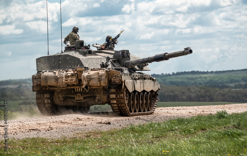 British army FV4034 Challenger 2 main battle tank in action on a military exercise, gun barrel targetting sideways, Salisbury Plain Wiltshire UK