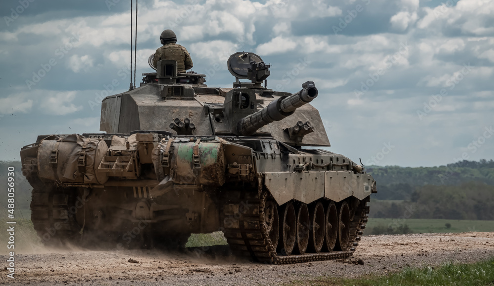 close up of a British army FV4034 Challenger 2 main battle tank in action on a military exercise, gun barrel targetting rear flank, Salisbury Plain Wiltshire UK close up of a British army FV4034 Challenger 2 main battle tank in action on a military exercise, gun barrel targetting rear flank, Salisbury Plain Wiltshire UK