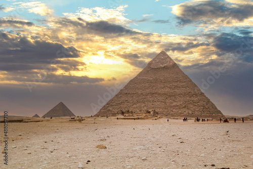 The Giza pyramids from the backside  a street leading to the pyramids