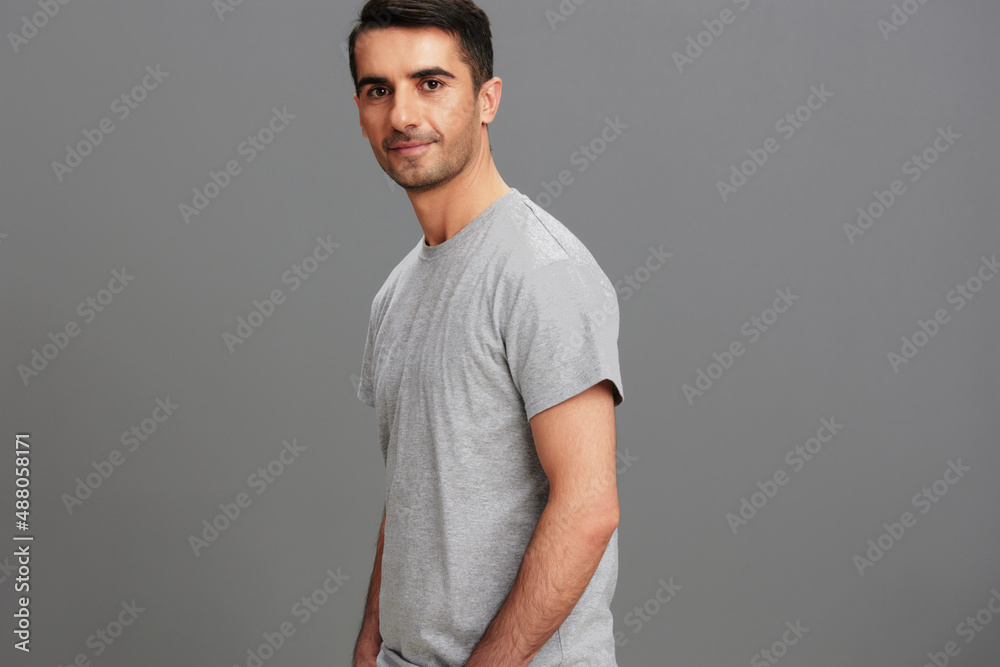 man fun gray t-shirt hand gesture isolated background man fun gray t-shirt hand gesture isolated background