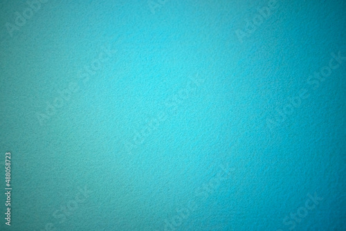 Blue texture of soft cardboard. Clear blue background. A clean place for a congratulatory text.High quality photo