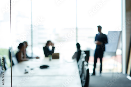 Corporate movers and shakers in action. Shot of a group of executives having a meeting in a boardroom.