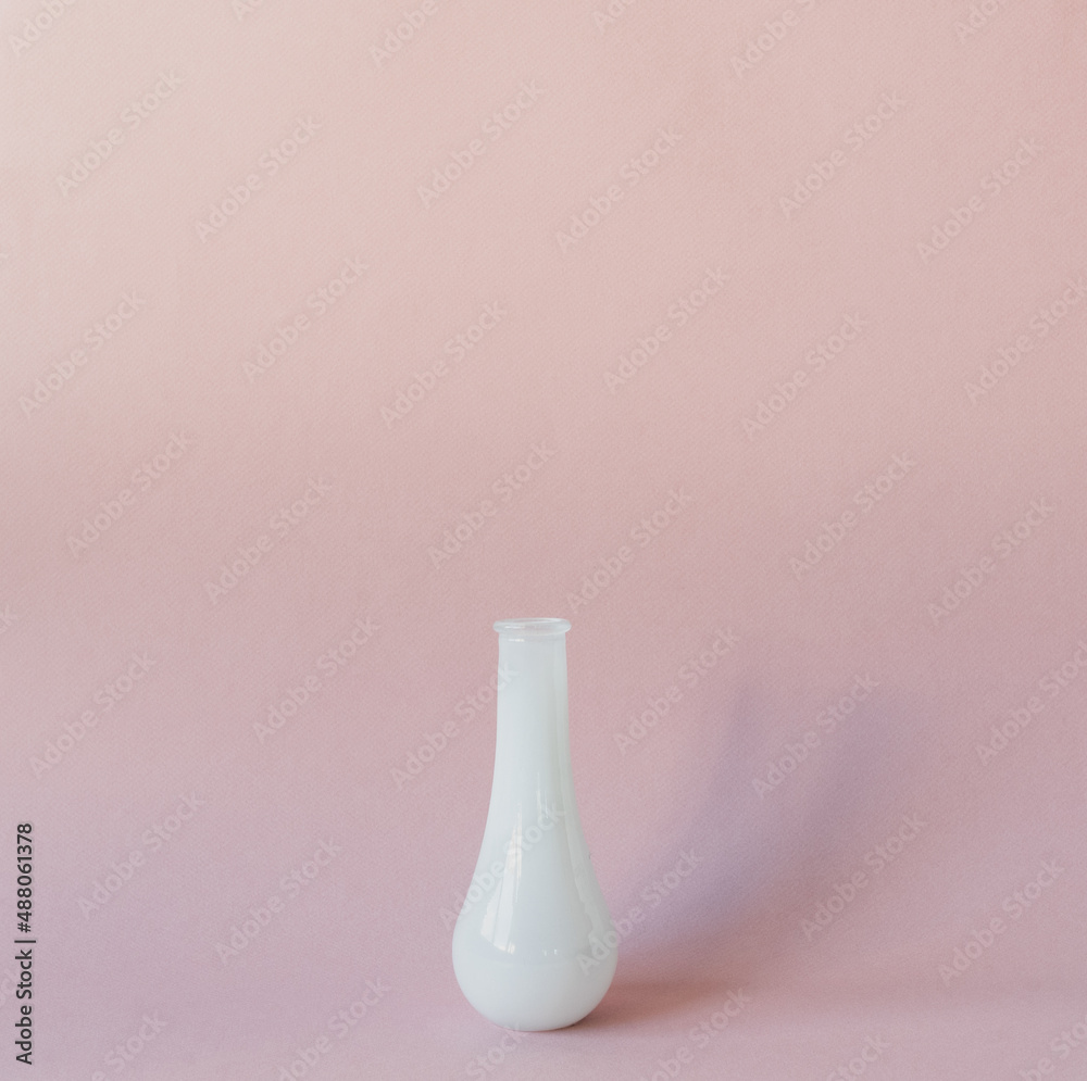 Close up of small white vase against textured pink background with matte filter effect Close up of small white vase against textured pink background with matte filter effect