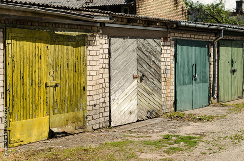 Wallpaper Mural Wooden garage doors of different colors, Ventspils, Latvia. Torontodigital.ca
