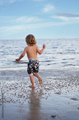 Boy running on beach