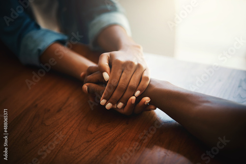 I promise itll get better. Closeup shot of two people holding hands in comfort.