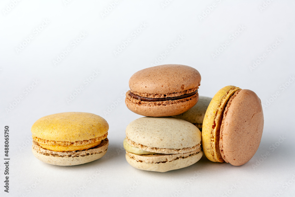 french cuisine - macaroons on a white background, close-up french cuisine - macaroons on a white background, close-up