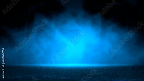 Mysterious smoke background in blue neon light over old asphalt. Street with a dark horror atmosphere. Night scene with fog without people. Horror smoke road. Background with smog.