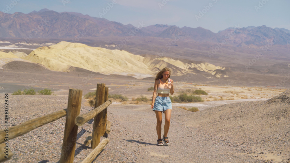 Young pretty woman exploring remains of industrial workings at the old Harmony Borax mine works in Death Valley National Park, California, USA. Young pretty woman exploring remains of industrial workings at the old Harmony Borax mine works in Death Valley National Park, California, USA.
