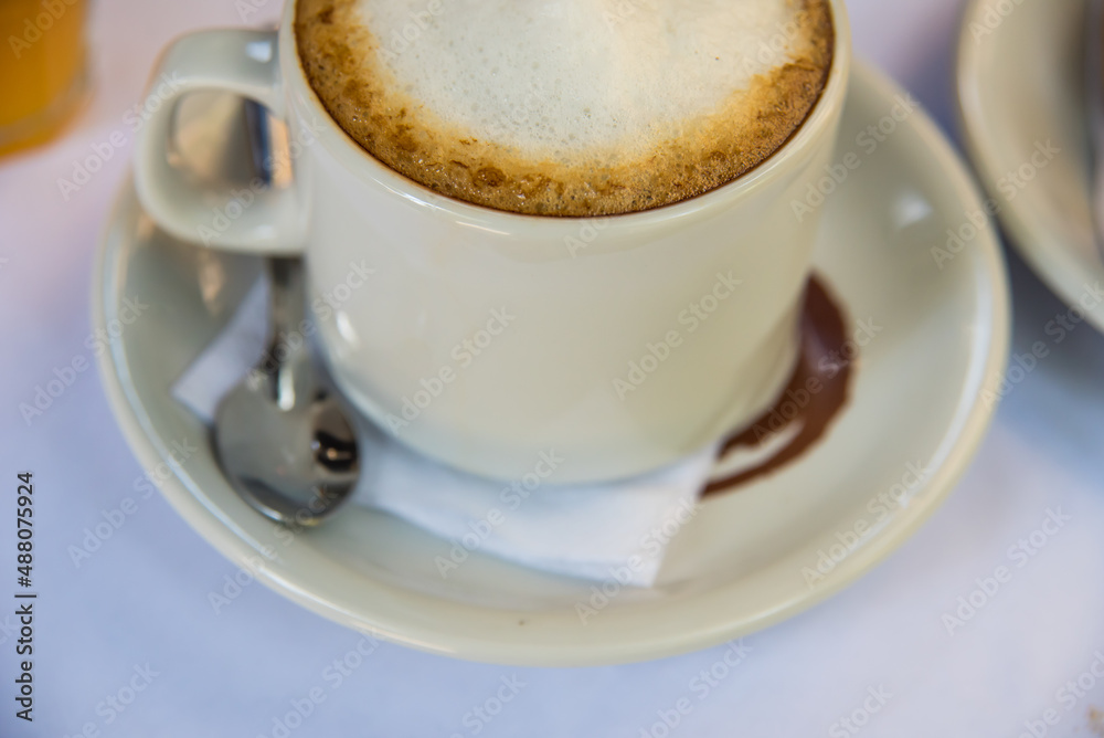 coffee with sparkling milk on a plate coffee with sparkling milk on a plate