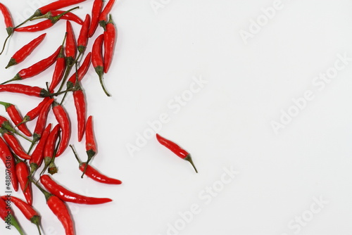 Raw red pepper, bunch of chili pepper on white