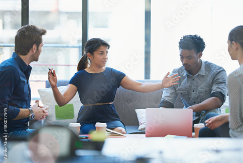 Expansion is important. Shot of a group of office workers talking together in a meeting room. photo