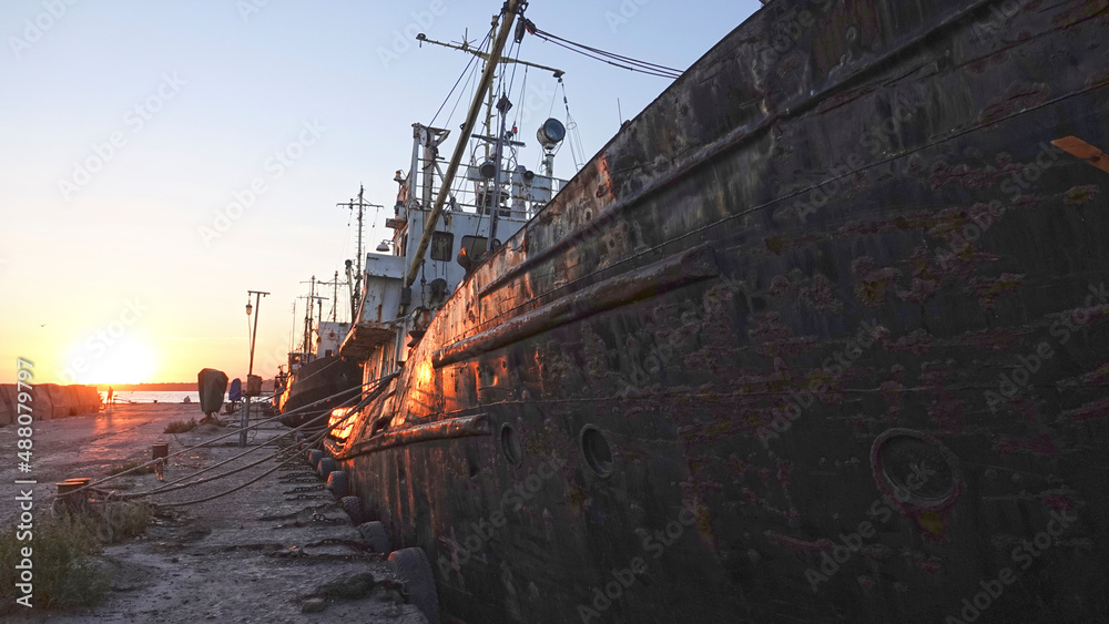 Fototapeta premium Old abandoned fishing boat at sunset