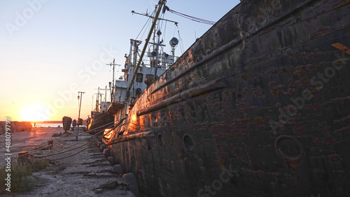 Old abandoned fishing boat at sunset
