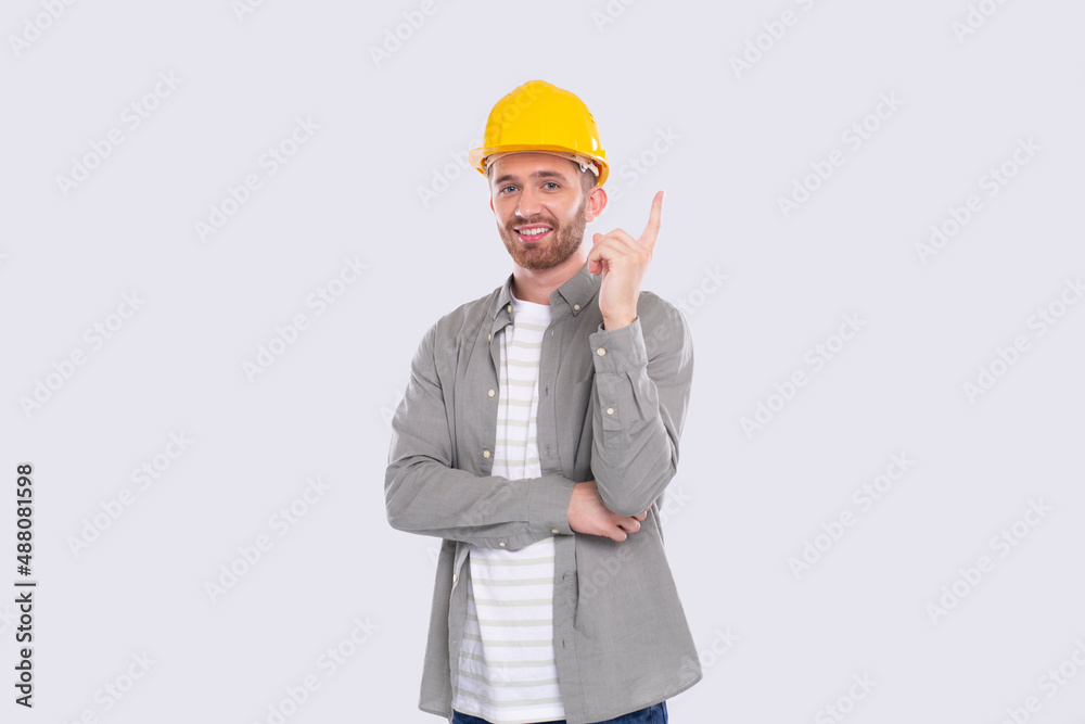 Construction Worker Having A Great Idea. Man with Idea Holding Finger Up. Worker in Hard Helmet Isolated Construction Worker Having A Great Idea. Man with Idea Holding Finger Up. Worker in Hard Helmet Isolated