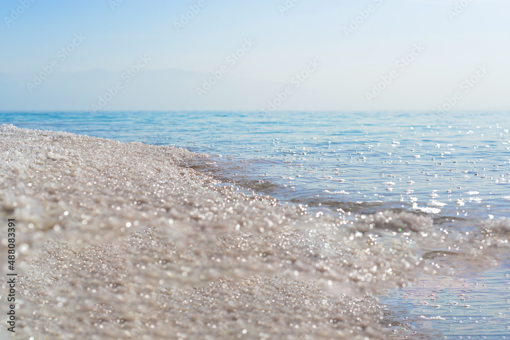 Close up of salt background. Natural salt. Dead Sea salt mineral natural formations. Salt crystals from Dead sea. View of Dead Sea coastline. Texture of Dead sea. Salty seashore rocks Close up of salt background. Natural salt. Dead Sea salt mineral natural formations. Salt crystals from Dead sea. View of Dead Sea coastline. Texture of Dead sea. Salty seashore rocks