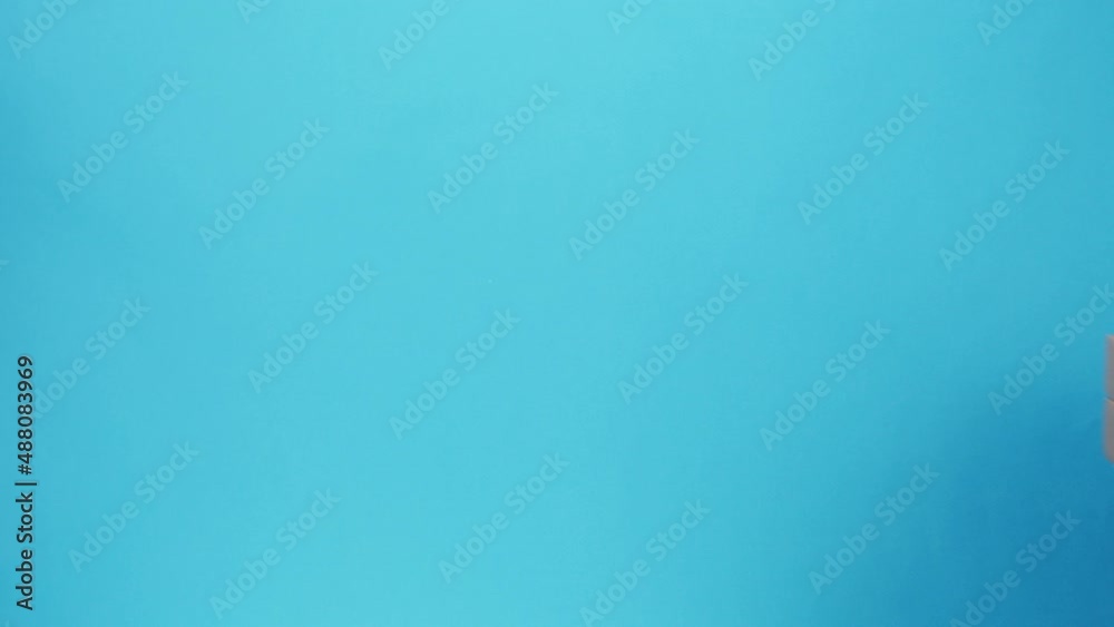 Square cardboard boxes on blue background. Preparing take away meals. Online contactless food shopping. Food delivery service. Courier giving order, delivering to customer. Square cardboard boxes on blue background. Preparing take away meals. Online contactless food shopping. Food delivery service. Courier giving order, delivering to customer.