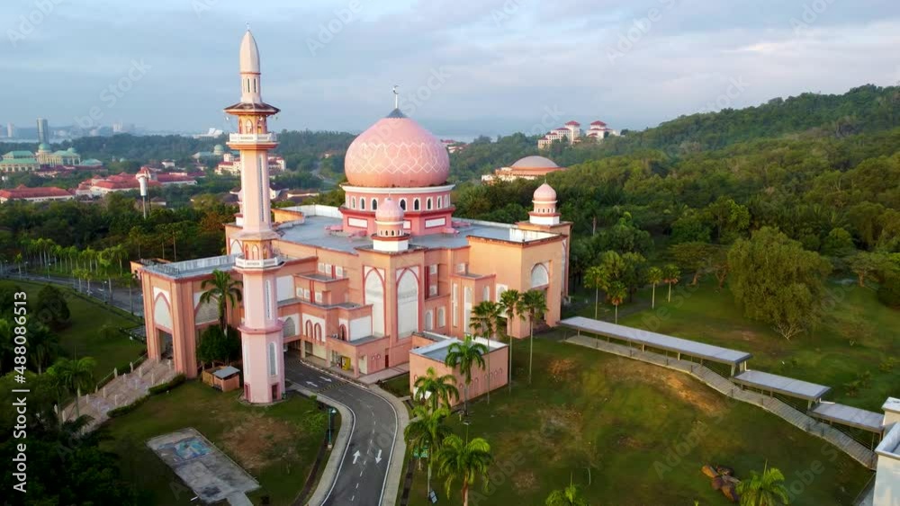 UMS Mosque or also known as Pink Mosque in Kota Kinabalu, Sabah, Malaysia. Aerial view with drones flying backwards. 