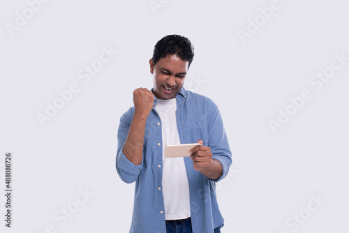Indian Man Excited Winning. Man Holding Phone. Winner. Man Won online Casino, Lottery