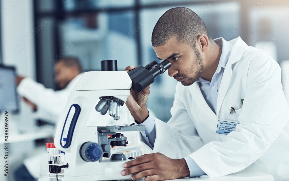 Always question, always wonder. Cropped shot of a young male scientist working in his lab. Always question, always wonder. Cropped shot of a young male scientist working in his lab.