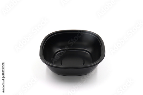 Black plastic box for food in the microwave on white background