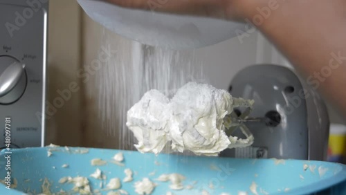 Mixing cake ingeredients in kitchen