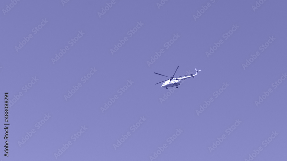 Obraz premium Helicopter against the sky, purple toning. Military theme