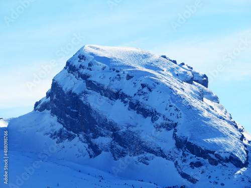 Snow-capped alpine peak Schibenstoll (2235 m) in the Churfirsten mountain range, between the Toggenburg region and Lake Walensee or Lake Walenstadt - Obertoggenburg, Switzerland (Schweiz) photo