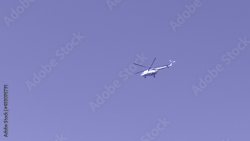 Helicopter against the sky, purple toning. Military theme photo