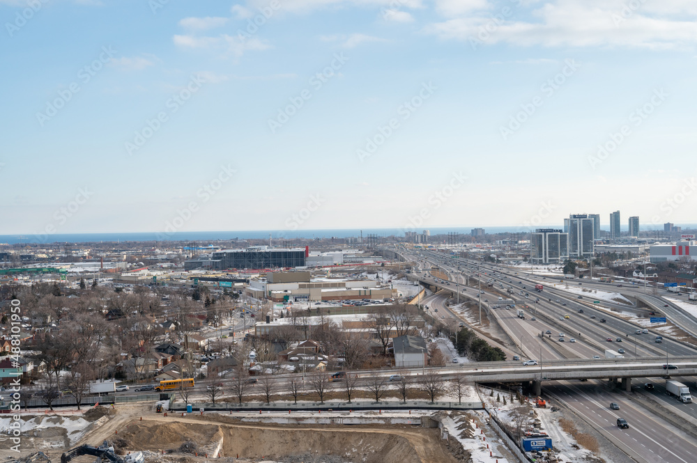views of downtown Toronto from mimco with snow and trees blue skies lake view and CN tower  in view 