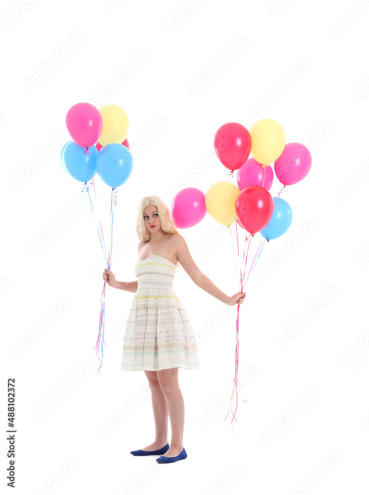 Full length portrait of blonde girl wearing party dress, holding bunch of colourful balloons. Isolated on white studio background
Full length portrait of blonde girl wearing party dress, holding bunch of colourful balloons. Isolated on white studio background