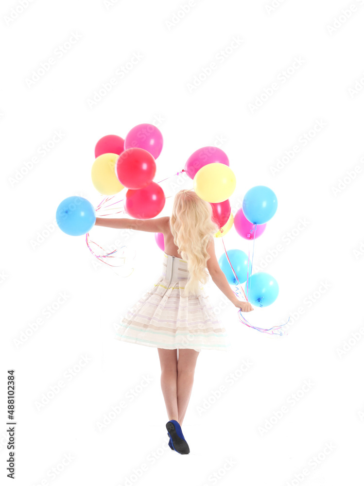 Full length portrait of blonde girl wearing party dress, holding bunch of colourful balloons. Isolated on white studio background
Full length portrait of blonde girl wearing party dress, holding bunch of colourful balloons. Isolated on white studio background