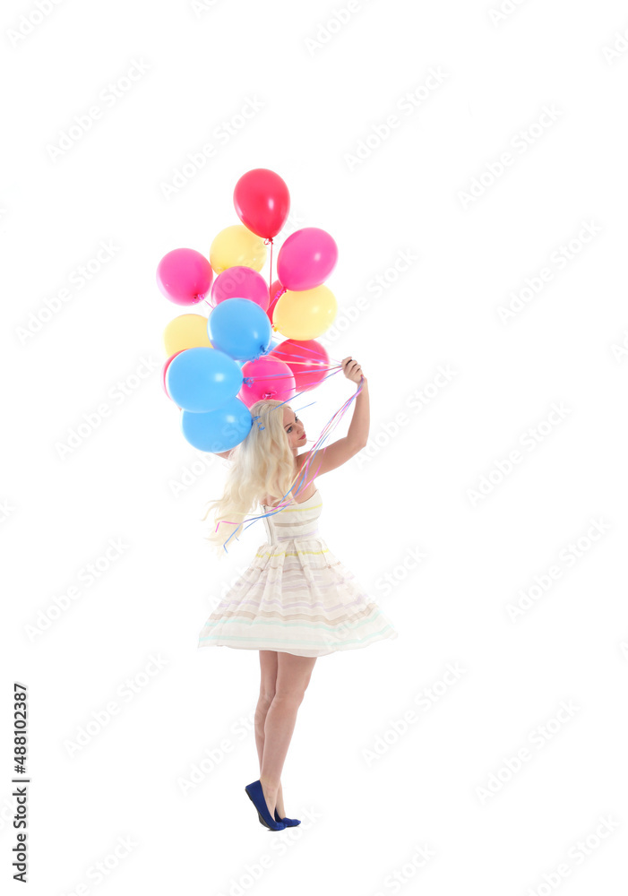 Full length portrait of blonde girl wearing party dress, holding bunch of colourful balloons. Isolated on white studio background
Full length portrait of blonde girl wearing party dress, holding bunch of colourful balloons. Isolated on white studio background