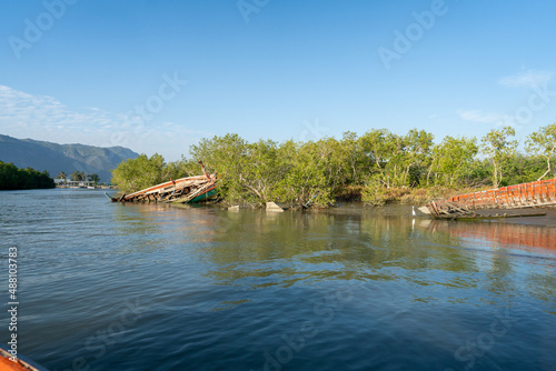 ship wreck on shore near swamp forest and clean water © Arthiti