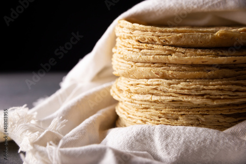Corn Tortillas. Food made with nixtamalized corn, a staple food in several American countries, an essential element in many Latin American dishes. photo