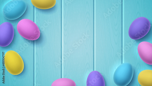 Volumetric painted 3D Easter eggs on blue wooden background. Bright vector illustration with place for text, copy space. Multi-colored wallpaper for spring Christian holiday.