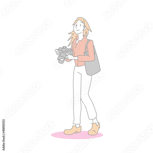 一眼カメラで撮影する女性