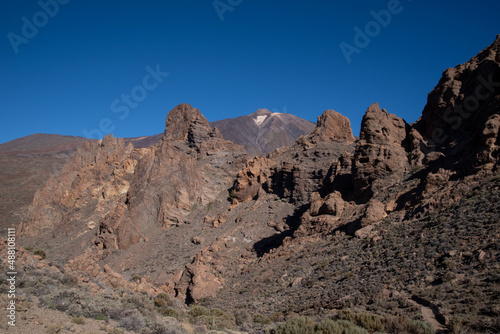  View of Roques de García unique rock formation with famous Pico del Teide mountain volcano summit in the background on a sunrise, Teide National Park, Tenerife, Canary Islands, Spain