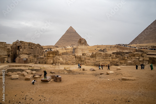 Great Sphinx against the background of the pyramids of the pharaohs Cheops and Khafre in Giza, Egypt