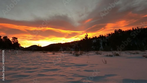 Golden Sunrise over Distant Snowy Mountains Rocky Mountains Colorado