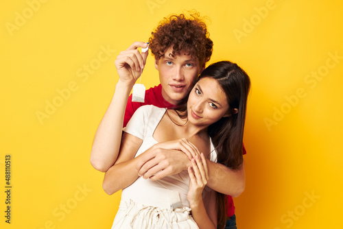 young couple together with a tea bag yellow background