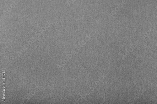 Seamless texture of fabric for upholstery of upholstered furniture in light gray color, natural textiles, woven threads matting, noisy structure