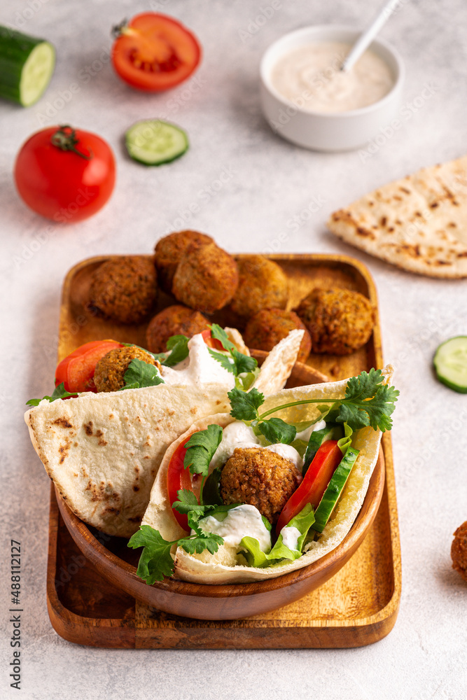 Falafel and fresh vegetables in pita bread