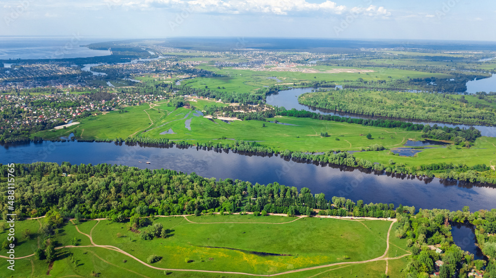 Aerial drone view of Dnieper and Dniester river near Kyiv, green islands from above, nature river landscape in spring, Ukraine
