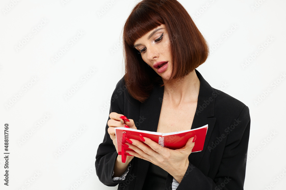 photo pretty woman writing in a notebook black jacket Lifestyle unaltered photo pretty woman writing in a notebook black jacket Lifestyle unaltered